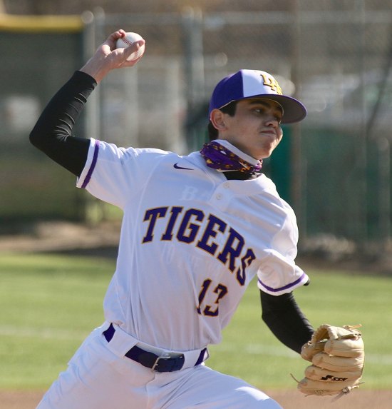 Lemoore's Reese Sartin helped pitch the Tigers to a 15-1 victory Tuesday on the school's diamond in their season opener.